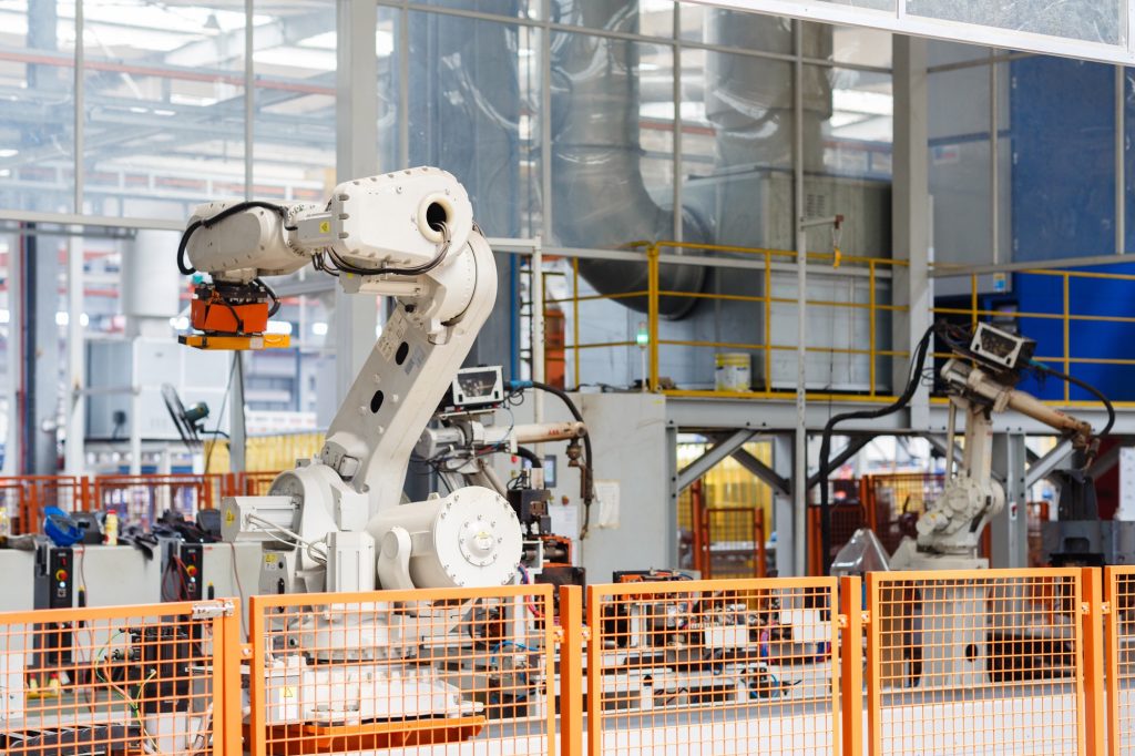 Industrial photo of Robot working on modern factory.